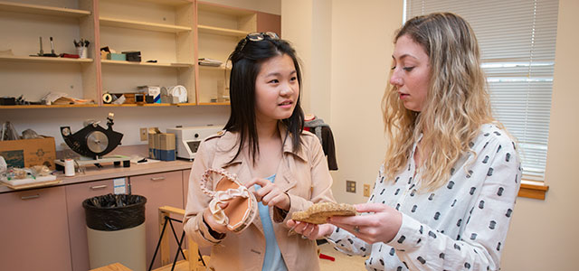 Students in the College of Arts and Sciences discuss a project